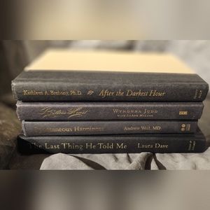 Four Miscellaneous Books. Slightly used.  3 black/gray. 1 cream & gray.